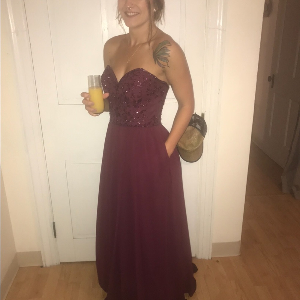 Size 2 maroon embellished bridesmaid dress. Worn once. Has been dry cleaned.
